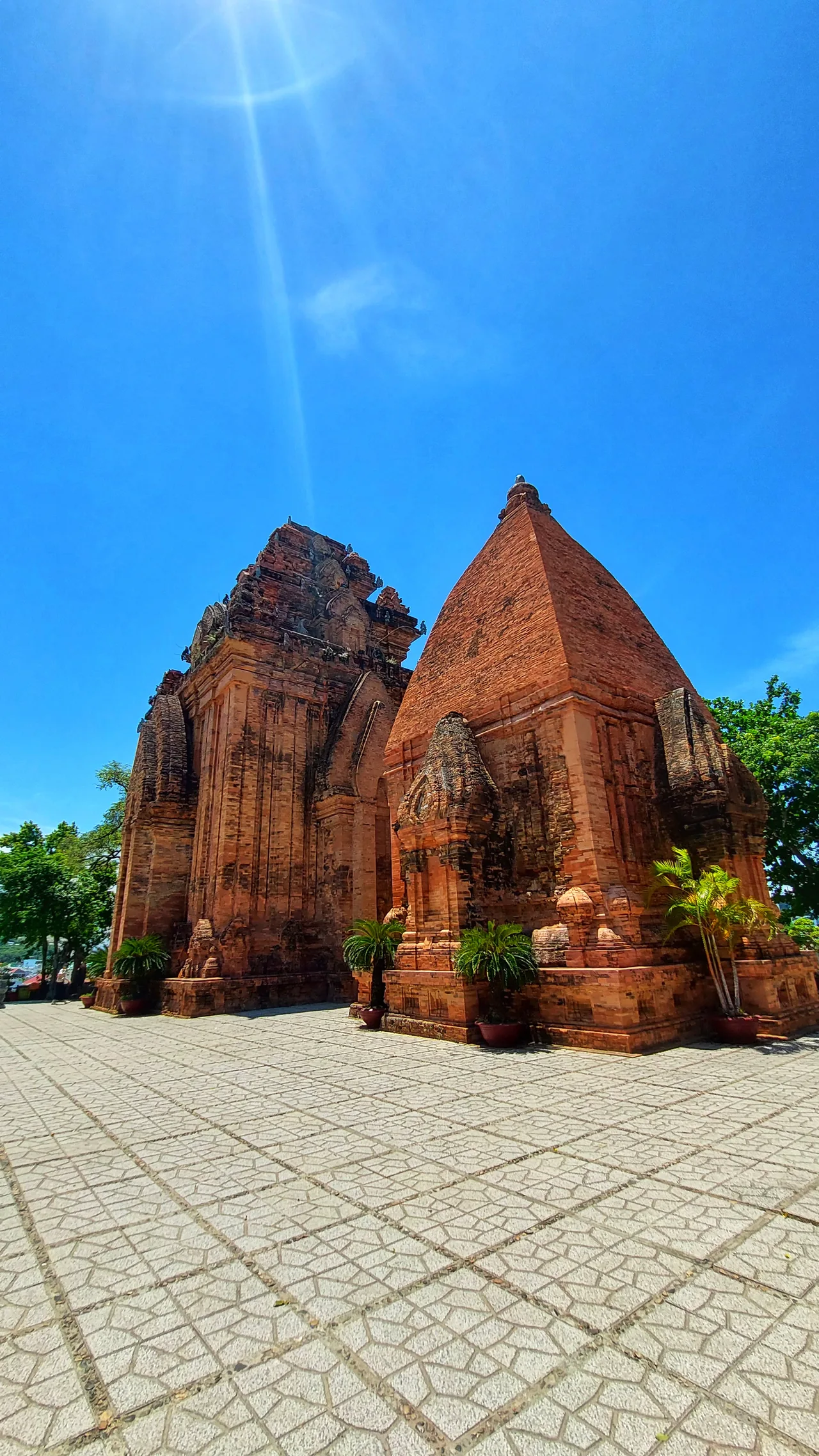 Red-brick towers and a paved courtyard at Po Nagar Temple in Nha Trang, Vietnam